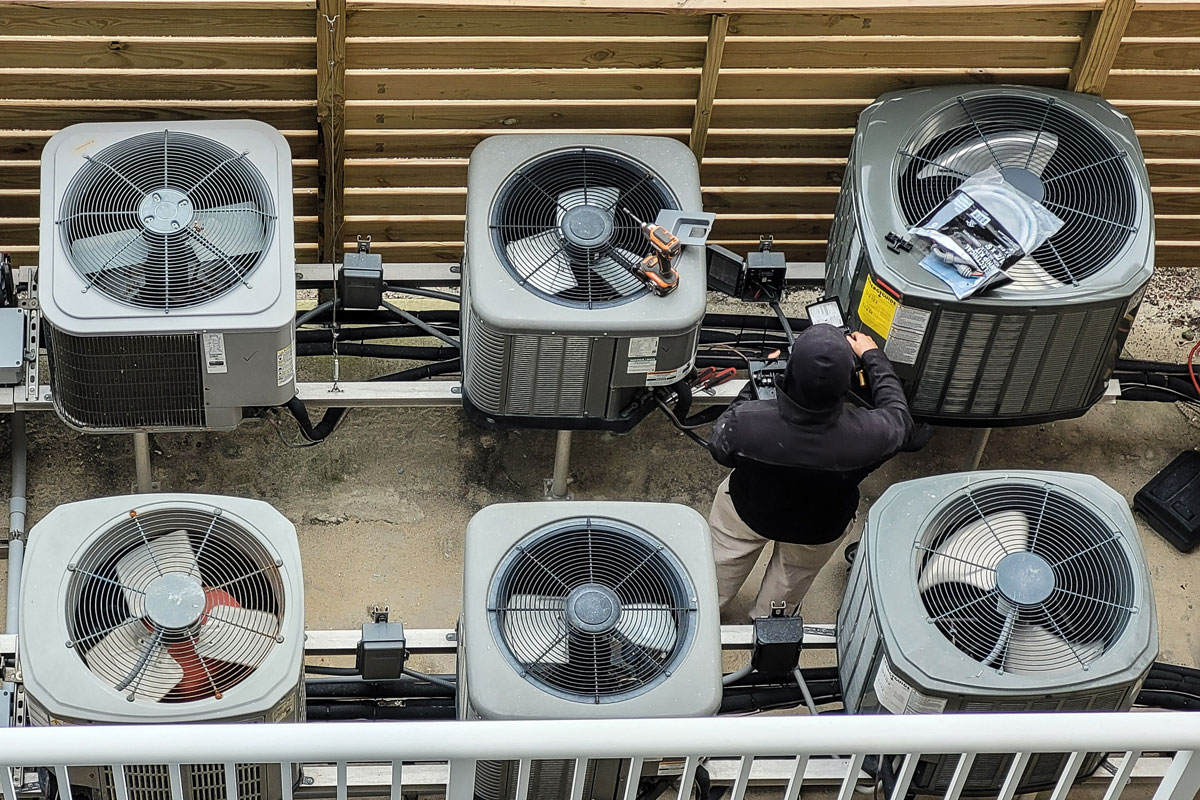 An AC technician performing AC repair