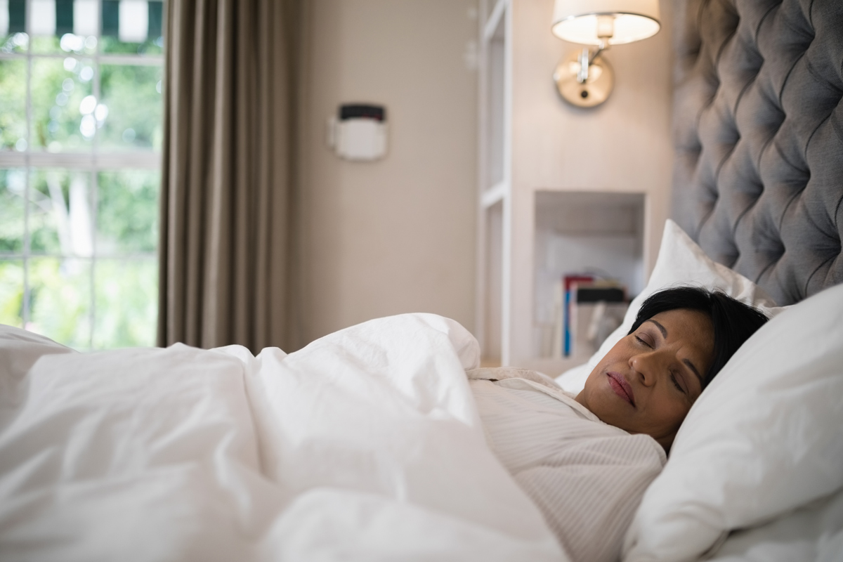a sleeping person by the window